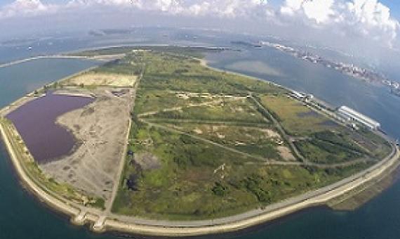 An aerial view of Semaku landfill that was created by filling in part of the sea between two of Singapore’s offshore islands, Pulau Se-makau and Pulau Sakeng. Credit - Island Nation.