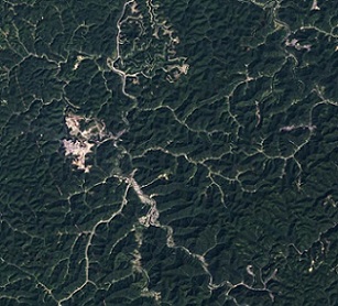 o access the coal contained in the Appalachian Mountains in southern West Virginia, extractive companies engage in a controversial mining method called "mountaintop removal," which Scientists have found that this process negatively impacts groundwater and biodiversity. Credit - NASA Earth Observatory