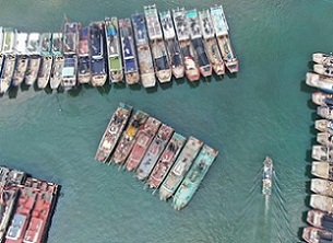 Aerial photo taken on May 13, 2020 shows fishing boats berthing at a harbor of the Hailing Island in Yangjiang, south China's Guangdong Province. (Xinhua/Deng Hua)
