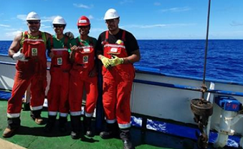 The multi-agency Cook Islands government team at sea aboard a research vessel. Eusenio Fatialofa (CIIC), Rima Browne (SBMA), Chloe Wragg (MMR) Junior Tapoki (NES). 19100490