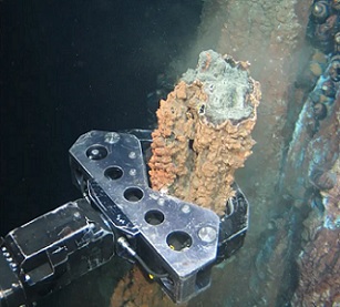 a grabber breaks off a section of hydrothermal vent. Photograph: Nautilus minerals