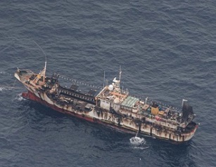 A fishing boat is seen from an aircraft of the Ecuadorian navy after a fishing fleet of mostly Chinese-flagged ships was detected in an international corridor that borders the Galapagos Islands’ exclusive economic zone, in the Pacific Ocean August 7, 2020. Picture taken August 7, 2020. REUTERS/Santiago Arcos