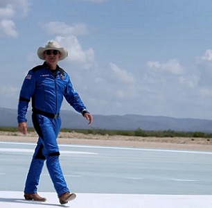 Billionaire Jeff Bezos walks on the tarmac near the Blue Origin rocket that took him to space on July 20. Joe Raedle/Getty Images