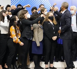 Former US president Barack Obama greets people at COP26 – where negotiators are seeking global progress on climate action. Credit - AP