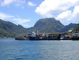Portion of the dock area at Fagatogo, Pago Pago Harbor, American Samoa with Rainmaker Mt. (Pioa Mtn.) in the background. Credit- Eric Guinther