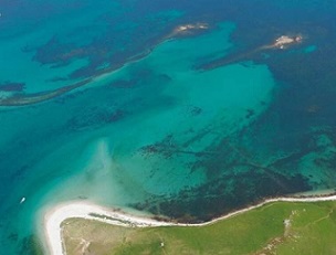 Aerial photograph of submerged stone field boundaries on Samson Flats, Isles of Scilly. Credit: Historic England Archive