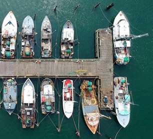 Aerial view of fishing boats at a dock in Southampton, New York. Credit: Jeffrey Blum / Unsplash