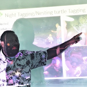 TNC Marine Scientist Simon Peter Vuto explains the work of Rangers at a leatherback turtle workshop. Credit - Ian Kaukui