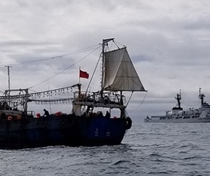 The crew of the Coast Guard Cutter Douglas Munro conducts a boarding of a Chinese fishing vessel. Credit - USCG