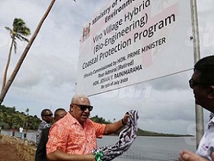 Prime Minister Voreqe Bainimarama commissions the Viro Village Hybrid (Bio-Engineering) Coastal Protection Programme at the village in Ovalau on July 15, 2020. He is accompanied by Minister for Waterways and Environment Mahendra Reddy (right). Photo: Kelera Sovasiga