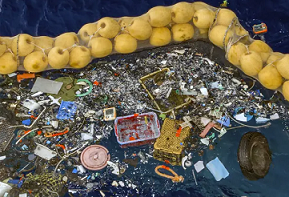 The boom skims up waste ranging in size from a discarded net and a car wheel to tiny chips of plastic. Photo credit: AP