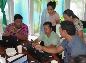 participants discussing input of field spatial data to QGIS software. Credit - V. Jungblut, SPREP