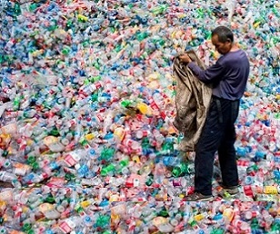 A Chinese labourer sorting out plastic bottles on the outskirt of Beijing. Photograph: Fred Dufour/AFP/Getty Images