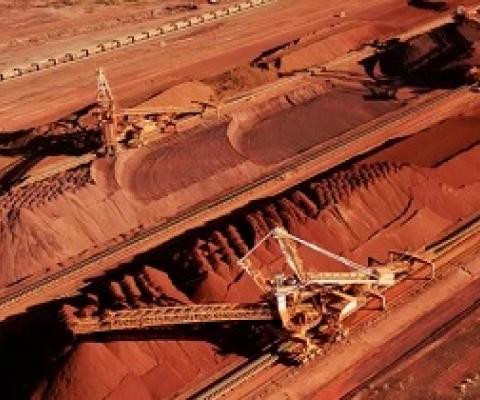  Iron ore is stockpiled for export at Port Hedland in Western Australia. BHP Billiton is on the cusp of destroying 86 Aboriginal sites in the central Pilbara to expand its South Flank iron ore mining operation. Photograph: Bhp Billiton/AFP/Getty Images