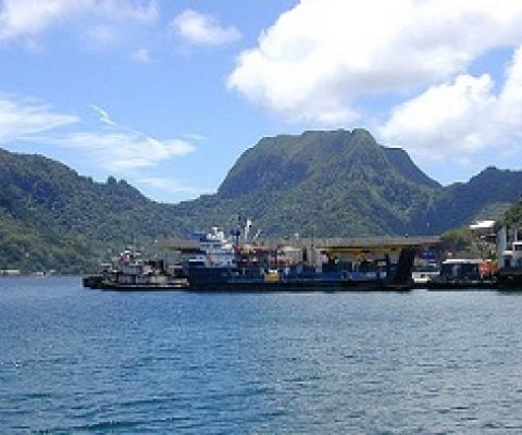 Portion of the dock area at Fagatogo, Pago Pago Harbor, American Samoa with Rainmaker Mt. (Pioa Mtn.) in the background. Credit- Eric Guinther