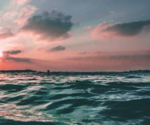 sunset over the ocean. Public Domain Unsplash / Joseph Barrientos