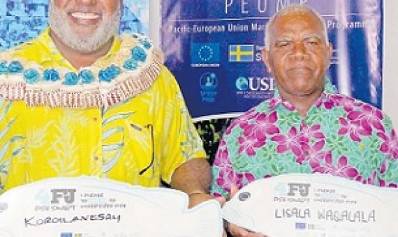 Minister for Fisheries Semi Koroilavesau and 4FJ Movement Champion Lisala Waqalala with their pledge boards at the launch. Credit - https://www.fijitimes.com/