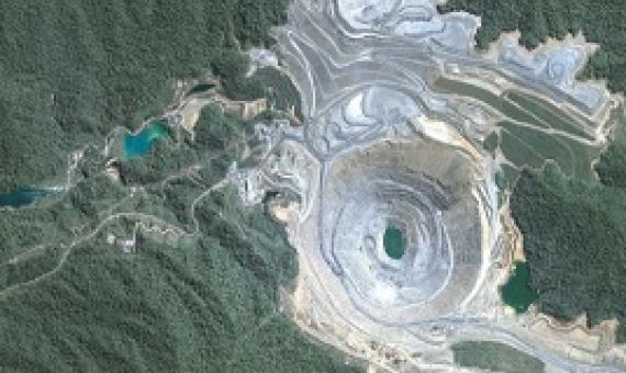An aerial view of the Batu Hijau open pit gold mine in Indonesia. Photo: SkyTruth, (CC BY-NC-SA 2.0)
