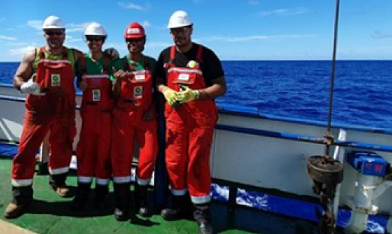 The multi-agency Cook Islands government team at sea aboard a research vessel. Eusenio Fatialofa (CIIC), Rima Browne (SBMA), Chloe Wragg (MMR) Junior Tapoki (NES). 19100490