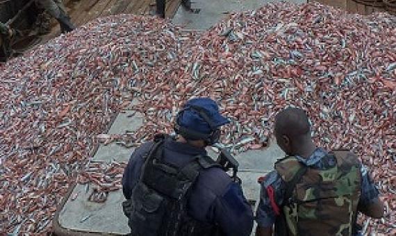 U.S. Coast Guard officials and a Ghanaian Navy sailor inspect a fishing vessel suspected of illegal fishing. Image courtesy of the U.S. Navy/Kwabena Akuamoah-Boateng.