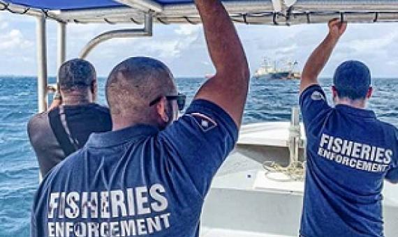 Marshall Islands fisheries officers Beau Bigler and Melvin Silk head across Majuro Lagoon in February 2020 to board and inspect an arriving vessel. Credit - Francisco Blaha.