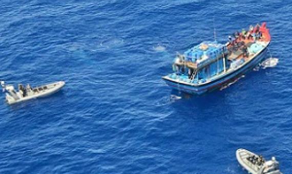 A Vietnamese illegal fishing vessel in the Coral Sea being intercepted by Australian Border Force. AAP Image/Department of Immigration and Border Protection