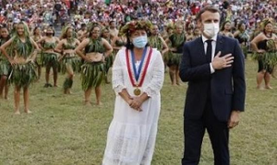 France's President Emmanuel Macron (R) and Hiva Oa Mayor Joëlle Frebault (in white) attend a welcoming ceremony during his visit to Atuona on Hiva Oa, the second largest island of the Marquesas Islands, French Polynesia on July 25, 2021. Photo: Ludovic MARIN / AFP