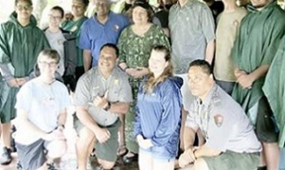 Congresswoman Amata and U.S. Mint Director David Ryder joined a hardworking team from the Park sheltering from a tropical rain in Feb. 2020. National Park Week is being celebrated this week. [courtesy photo]