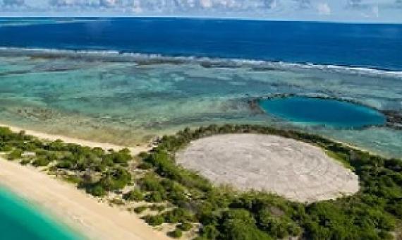 The dome on Runit Island with a crater left behind by another nuclear test. Photograph: Greg Nelson