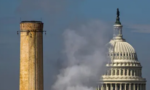 The dome of the US Capitol is seen behind the smokestacks of the Capitol Power Plant, a coal-burning plant in Washington DC. Photograph: Jim Lo Scalzo/EPA