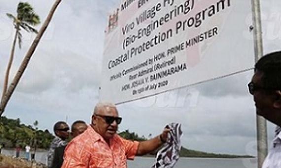Prime Minister Voreqe Bainimarama commissions the Viro Village Hybrid (Bio-Engineering) Coastal Protection Programme at the village in Ovalau on July 15, 2020. He is accompanied by Minister for Waterways and Environment Mahendra Reddy (right). Photo: Kelera Sovasiga