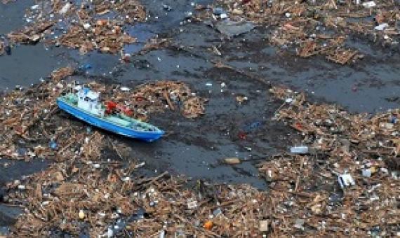 Some of the debris washed out to sea by Japan’s 2011 tsunami. Some of it came ashore the following year in the US. Photograph: Science History Images/Alamy