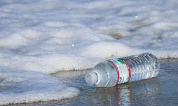 plastic water bottle on the beach. Credit: Unsplash/CC0 Public Domain